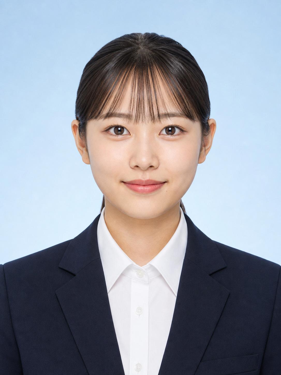 Japanese woman in a navy suit on a light blue background